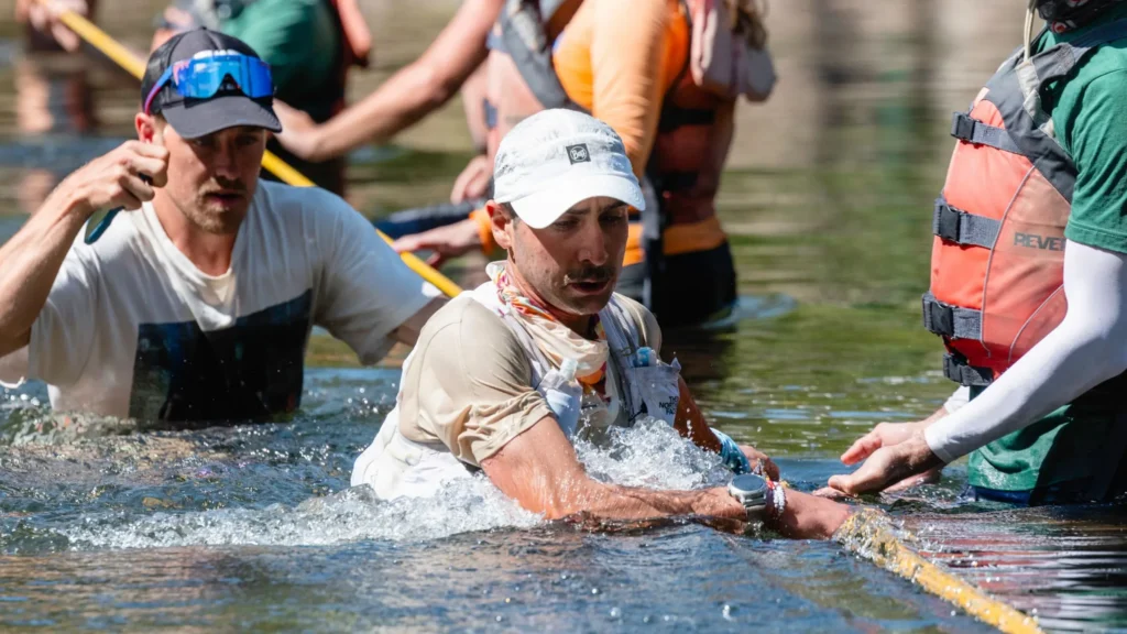 Western States endurance runner receiving assistance at an aid station