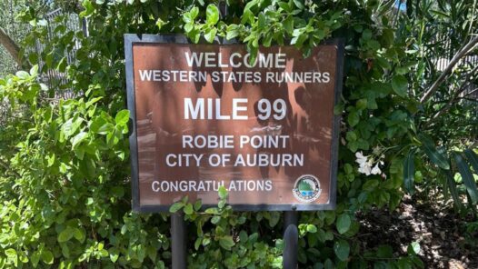 Western States runners welcome sign at Mile 99 in Auburn California